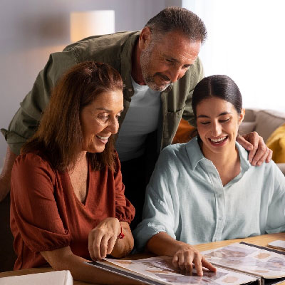 Homeowner family signing their closing documents after selling their property
