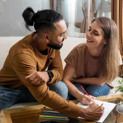 Homeowners couple signing closing documents after selling his property