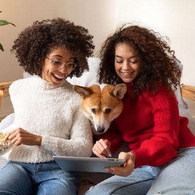 Homeowners reviewing closing documents with pet dog after selling their property
