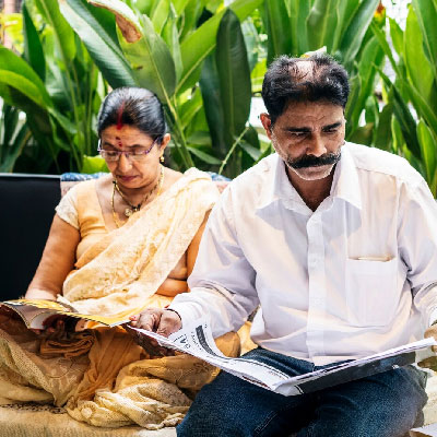 Homeowners reviewing the closing documents in preparation to close on their property